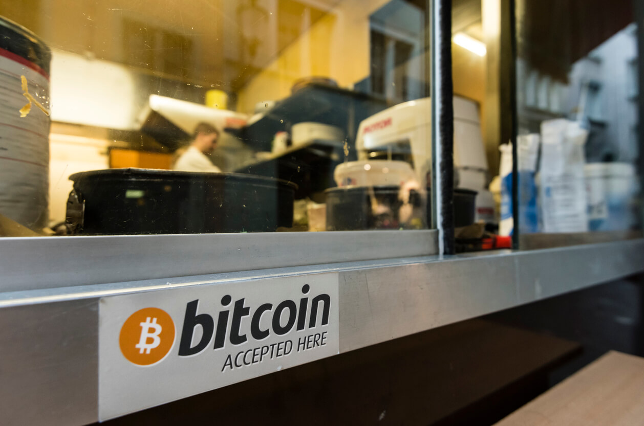bitcoin accepted here sign on shop window
