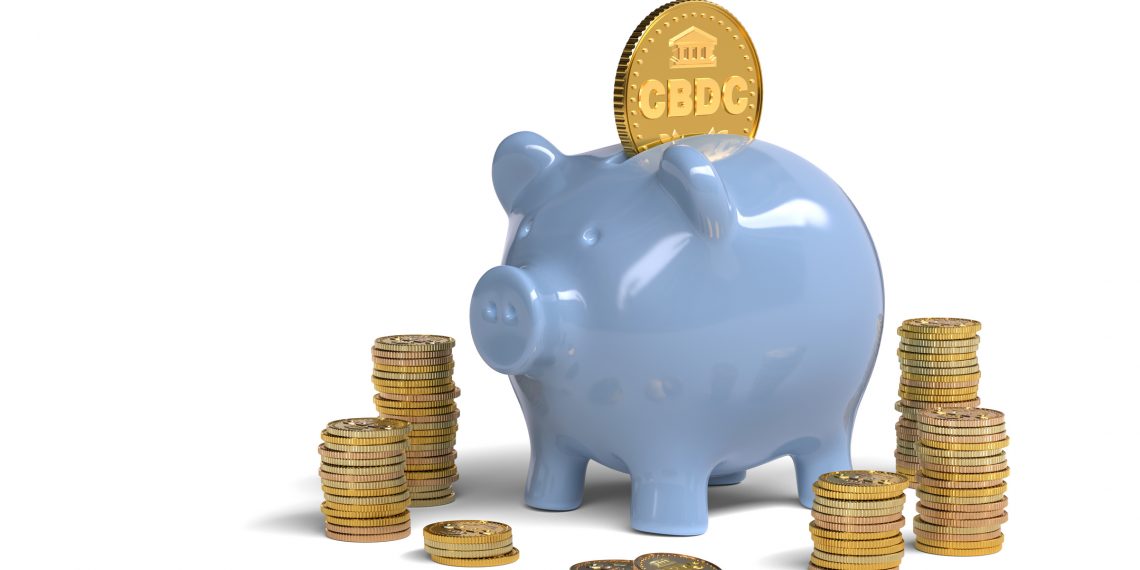 CBDC coin and piggy bank on white background.