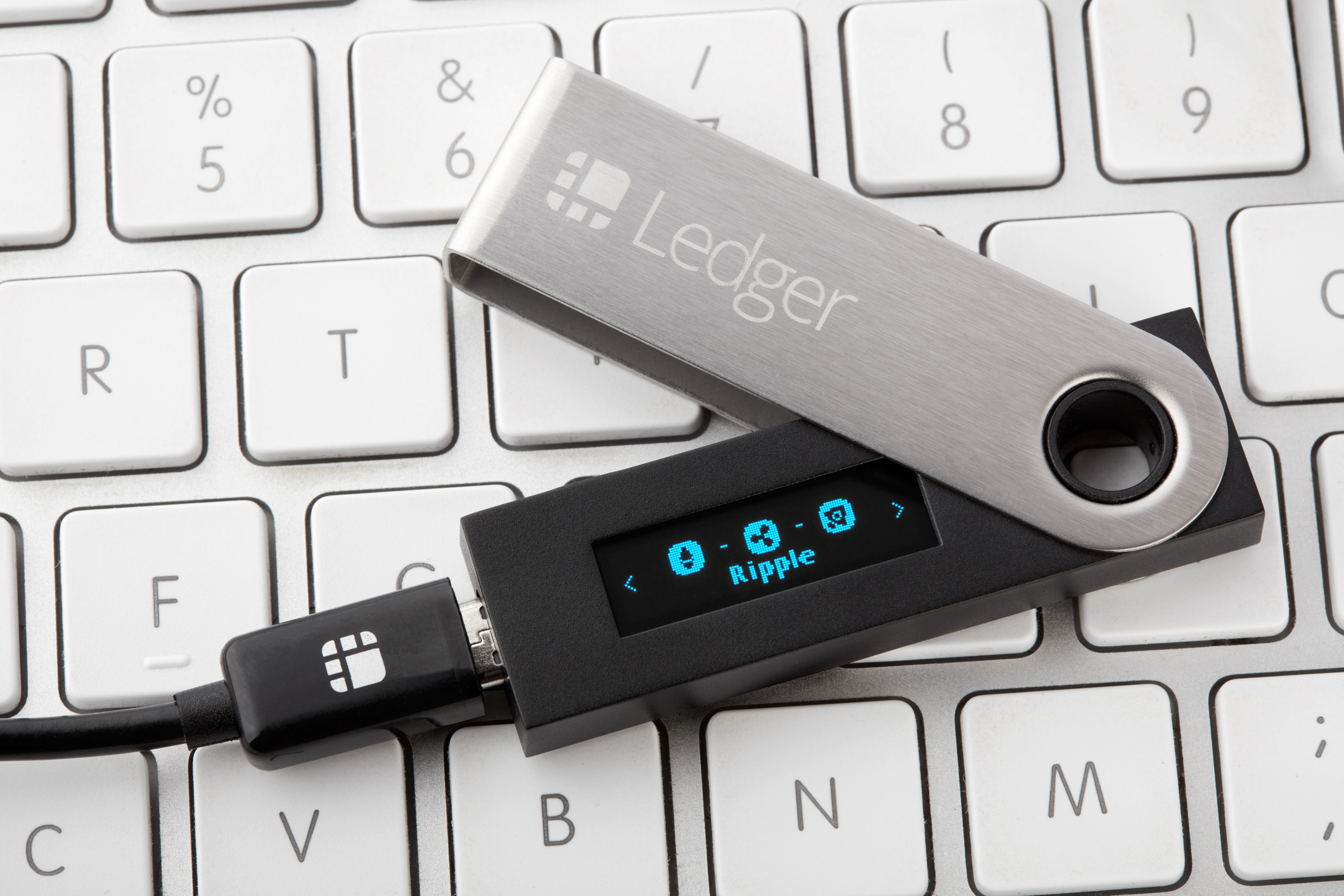 Milan, Italy - February 2, 2018: Ledger hardware wallet for cryptocurrency with Ripple coin selection in Milan