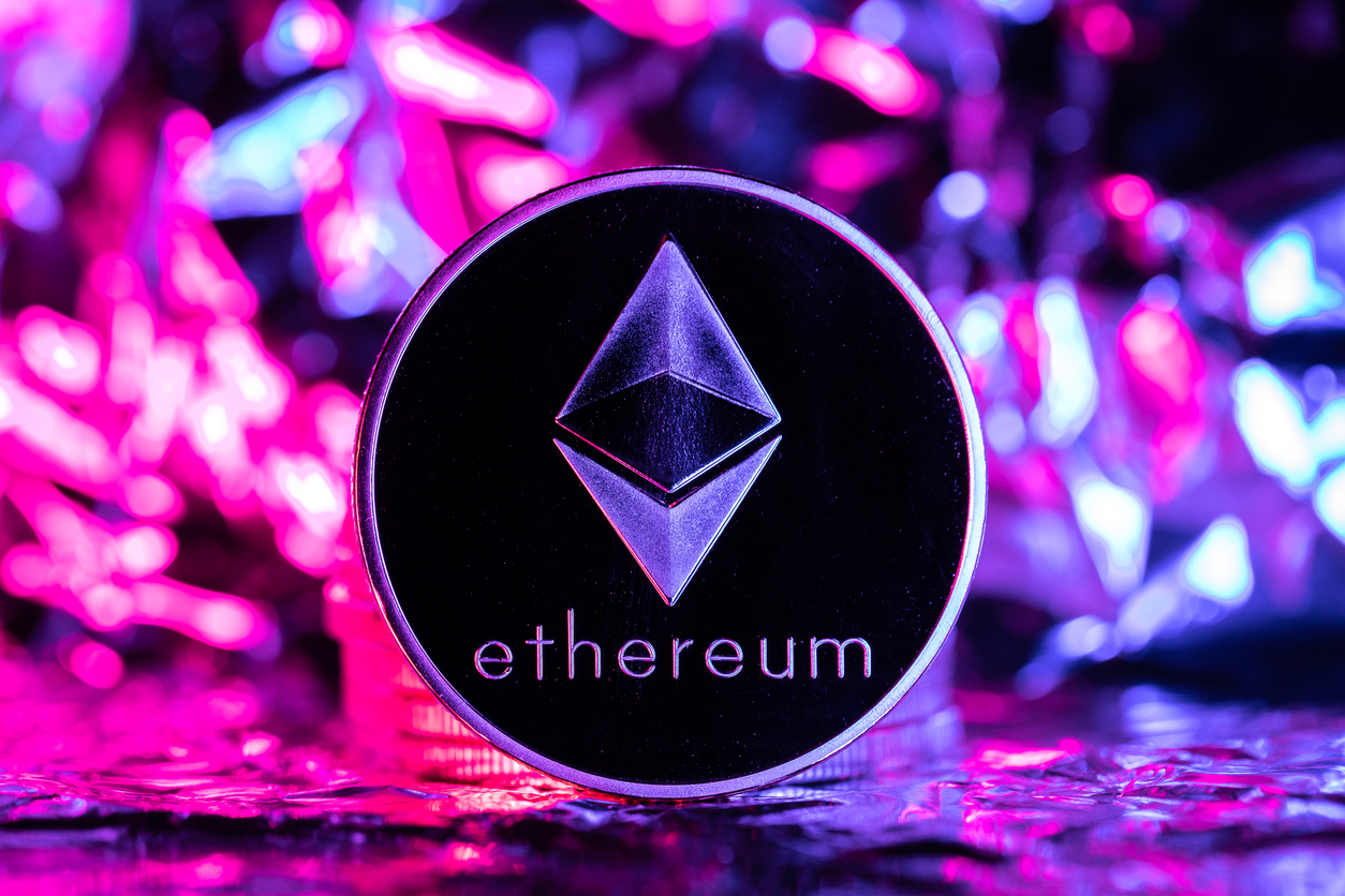 Ethereum cryptocurrency, physical coin in front of an abstract background