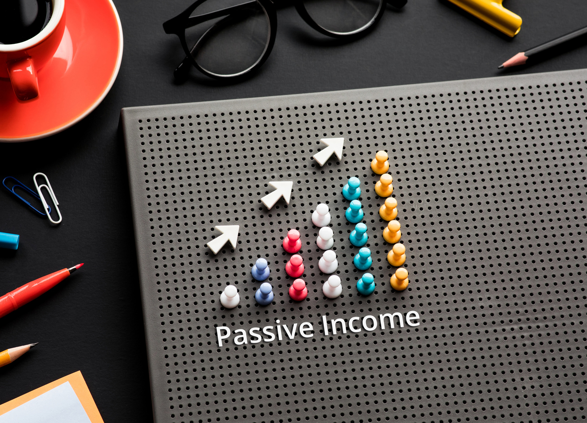 Passive income text with pin garph chart on business table.vision to success and strategy plan.